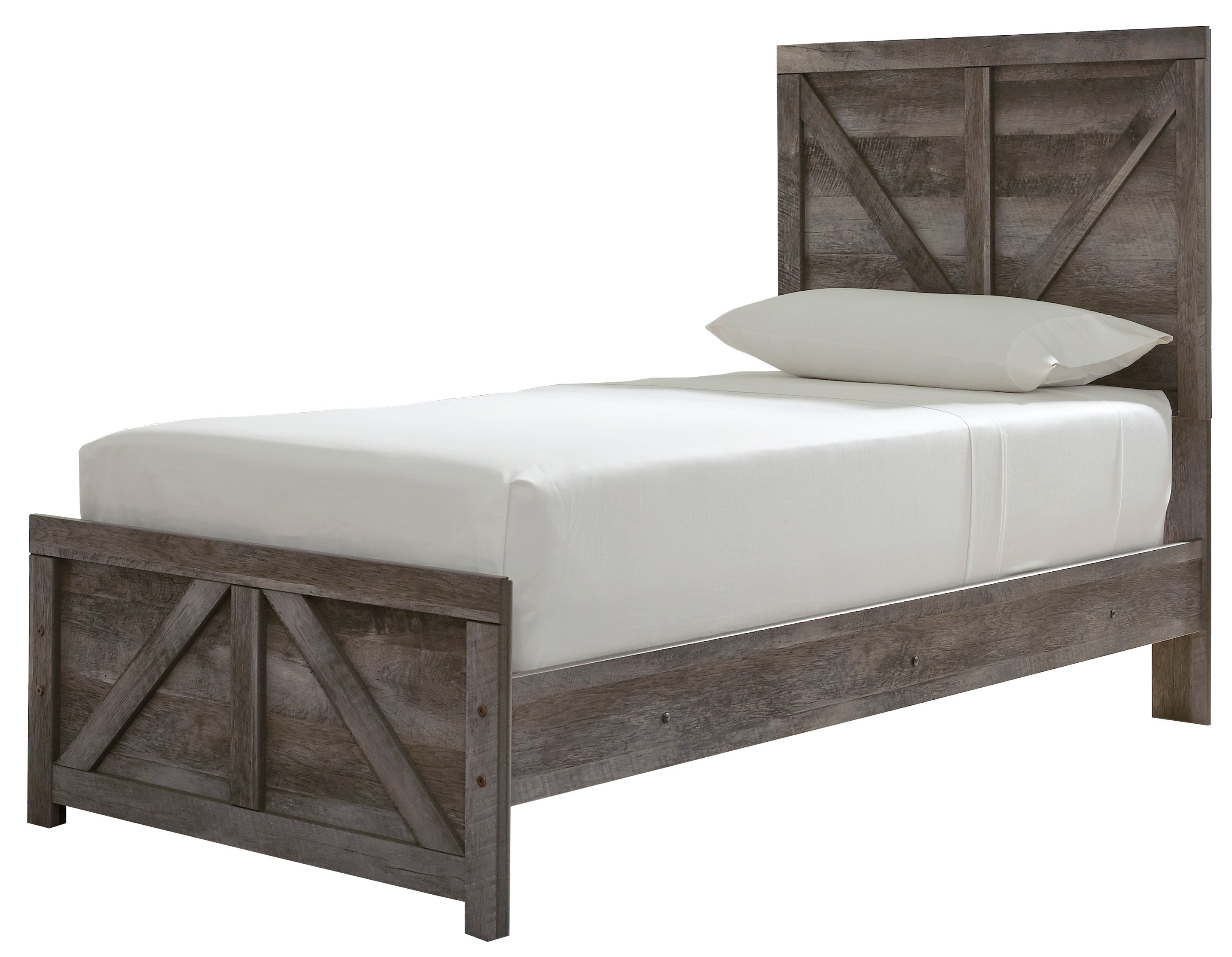 A twin-sized panel bed with a gray weathered oak finish and a large crossbuck design at the footboard, accompanied by a white mattress and pillows.